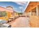 Backyard patio area with tables and chairs at 2256 Sabroso St, Las Vegas, NV 89156