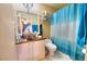 Clean bathroom with teal shower curtain and vessel sink at 2256 Sabroso St, Las Vegas, NV 89156