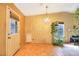 Bright dining area with chandelier and access to patio at 2256 Sabroso St, Las Vegas, NV 89156