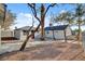 Backyard view showcases desert landscaping, mature trees, privacy fencing, and residential units at 240 S 16Th St, Las Vegas, NV 89101