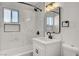 Bright bathroom features modern vanity with white countertop and black faucet and fixtures at 240 S 16Th St, Las Vegas, NV 89101