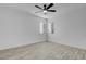 Bright bedroom with a ceiling fan, wood-look floors, and bright white walls at 240 S 16Th St, Las Vegas, NV 89101