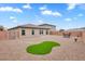 Backyard with artificial turf and a patio table at 2432 Mesa Wind Ave, North Las Vegas, NV 89030