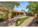 Landscaped backyard with a stone pathway and lush greenery at 2563 Collinsville Dr, Henderson, NV 89052