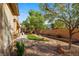 Landscaped backyard with a stone pathway and lush greenery at 2563 Collinsville Dr, Henderson, NV 89052
