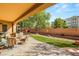 Relaxing backyard oasis with covered patio and seating area at 2563 Collinsville Dr, Henderson, NV 89052