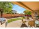 Covered patio, artificial turf, and a built-in grill at 2563 Collinsville Dr, Henderson, NV 89052