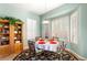 Charming breakfast nook with a round table and floral chairs at 2563 Collinsville Dr, Henderson, NV 89052