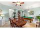 Dining room with a wooden table and pool table in the background at 2563 Collinsville Dr, Henderson, NV 89052