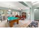 Game room with a pool table, dining area, and hardwood floors at 2563 Collinsville Dr, Henderson, NV 89052