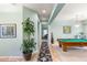 Long hallway with a large plant and access to other rooms at 2563 Collinsville Dr, Henderson, NV 89052