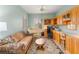 Home office featuring wooden cabinetry and a comfortable couch at 2563 Collinsville Dr, Henderson, NV 89052