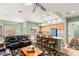 Open kitchen with island, light wood cabinets, and teal appliances at 2563 Collinsville Dr, Henderson, NV 89052