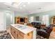 Spacious kitchen island with gas cooktop and views into the living area at 2563 Collinsville Dr, Henderson, NV 89052