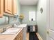 Convenient laundry room with washer, dryer, and storage at 2563 Collinsville Dr, Henderson, NV 89052