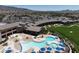 Resort-style pool with lounge chairs and umbrellas at 2563 Collinsville Dr, Henderson, NV 89052