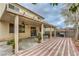 Spacious backyard patio with covered pergola and brick pavers at 2671 Colina Bella Ct, Las Vegas, NV 89142
