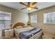 Bright bedroom with double bed, ceiling fan and large windows at 2671 Colina Bella Ct, Las Vegas, NV 89142