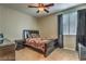 Well-lit bedroom with a double bed, nightstand and ceiling fan at 2671 Colina Bella Ct, Las Vegas, NV 89142