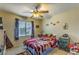 Cozy bedroom with a double bed, ceiling fan, and ample closet space at 2671 Colina Bella Ct, Las Vegas, NV 89142