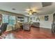 Spacious bonus room features hardwood floors, comfortable seating, and large windows at 2671 Colina Bella Ct, Las Vegas, NV 89142