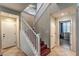 Bright entryway with staircase, wood flooring, and access to other rooms at 2671 Colina Bella Ct, Las Vegas, NV 89142
