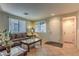 Living area showcasing a neutral color palette and ample natural light at 2671 Colina Bella Ct, Las Vegas, NV 89142