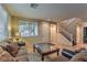 Comfortable living room with tiled floors and plenty of natural light at 2671 Colina Bella Ct, Las Vegas, NV 89142