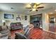 Large loft with hardwood floors, comfortable seating, and entertainment center at 2671 Colina Bella Ct, Las Vegas, NV 89142