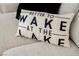 Throw pillow with the text 'Better to wake at the lake' at 29 Montelago Blvd # 337, Henderson, NV 89011