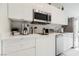 Modern kitchen with stainless steel appliances and white cabinetry at 29 Montelago Blvd # 337, Henderson, NV 89011