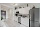 Modern white kitchen with stainless steel appliances and white cabinets at 29 Montelago Blvd # 337, Henderson, NV 89011