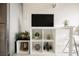 Living area with flat-screen TV and stylish storage shelving unit at 29 Montelago Blvd # 337, Henderson, NV 89011