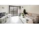 Spacious living room with balcony access and contemporary furnishings at 29 Montelago Blvd # 337, Henderson, NV 89011