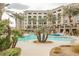 Inviting pool area with palm trees at 29 Montelago Blvd # 337, Henderson, NV 89011
