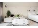 Open-concept studio apartment with comfy seating and a white bed at 29 Montelago Blvd # 337, Henderson, NV 89011