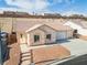 Single-story home with a two-car garage and desert landscaping at 2915 Rippling Springs St, Laughlin, NV 89029