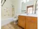 Bathroom with shower/tub combo, wood vanity, and tiled floor at 2915 Rippling Springs St, Laughlin, NV 89029