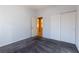 Bright bedroom with white walls, grey carpet, and double door closet at 2915 Rippling Springs St, Laughlin, NV 89029