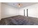 Bright bedroom featuring ceiling fan and ample closet space at 2915 Rippling Springs St, Laughlin, NV 89029
