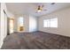 Primary bedroom with ensuite bathroom access and ceiling fan at 2915 Rippling Springs St, Laughlin, NV 89029