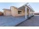 Home exterior showcasing garage and covered patio at 2915 Rippling Springs St, Laughlin, NV 89029
