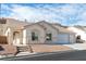 Single-story house with a two-car garage and landscaped yard at 2915 Rippling Springs St, Laughlin, NV 89029