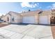 House exterior with a three-car garage and well maintained landscaping at 2915 Rippling Springs St, Laughlin, NV 89029