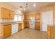 Bright kitchen, featuring wood cabinets and tile flooring at 2915 Rippling Springs St, Laughlin, NV 89029