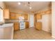 Modern kitchen with wood cabinets and tile floors at 2915 Rippling Springs St, Laughlin, NV 89029