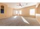 Spacious living room featuring neutral walls and carpet at 2915 Rippling Springs St, Laughlin, NV 89029