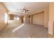 Large living room with carpet and views into the kitchen at 2915 Rippling Springs St, Laughlin, NV 89029
