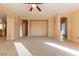 Spacious living room with carpet and views to kitchen at 2915 Rippling Springs St, Laughlin, NV 89029