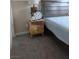 Bedroom with nightstand and gray carpet at 3031 Errol Flynn St # 101, Las Vegas, NV 89122